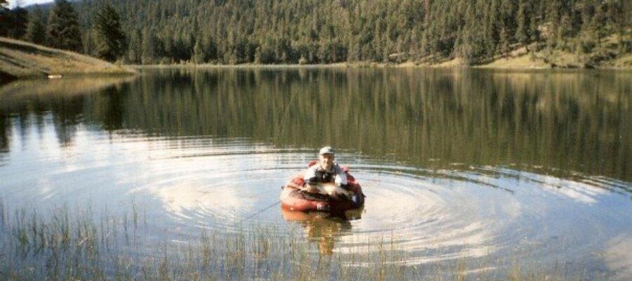A small lake in BC’s backcountry with clear water and defined shoals