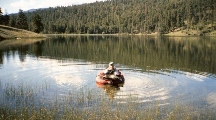 A small lake in BC’s backcountry with clear water and defined shoals